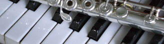 Photograph of a Flute on piano keys